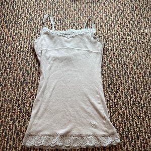 Girls Justice Tank Top with silver lace trimming.